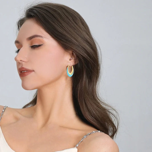 Κρίκοι από ανοξείδωτο ατσάλι με επίχρυση λεπτομέρεια και γαλάζιο της λίμνης