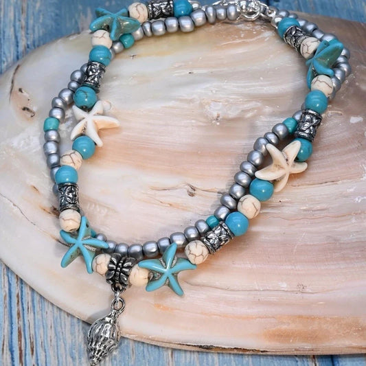 Βραχιόλι ποδιού με αστερίες και εντυπωσιακό charm κοχύλι σε boho καλοκαιρινό στυλ