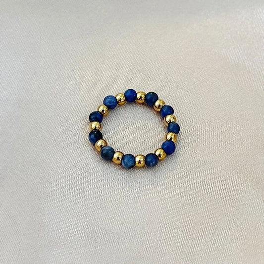 Δαχτυλίδι με μπλε πέτρες και χρυσές χάντρες σε ελαστική βάση