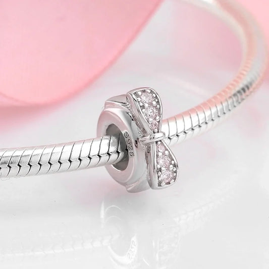 Κυκλικό charm με ανάγλυφο φιόγκο