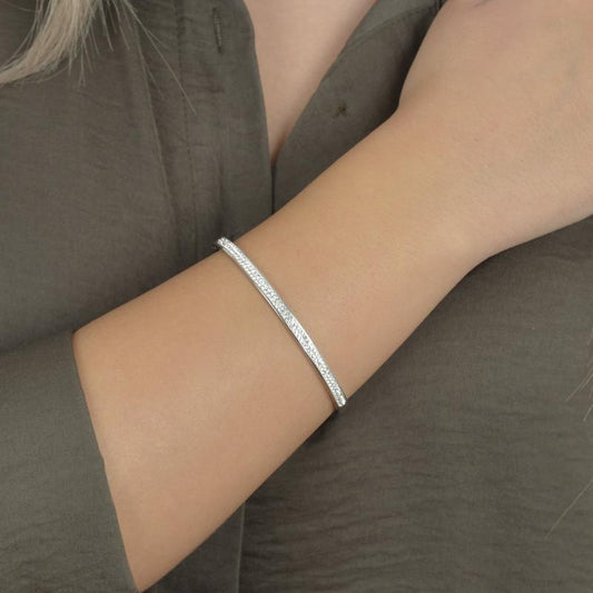 Βραχιόλι σε ασημί τόνο με λαμπερό στρας.