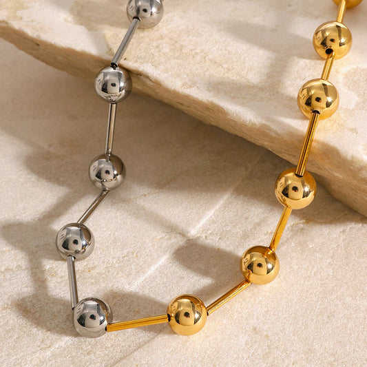 Δίχρωμο επιχρυσωμένο κολιέ από ανοξείδωτο ατσάλι με σφαιρικές λεπτομέρειες, μήκος 47cm, βάρος 19.8g