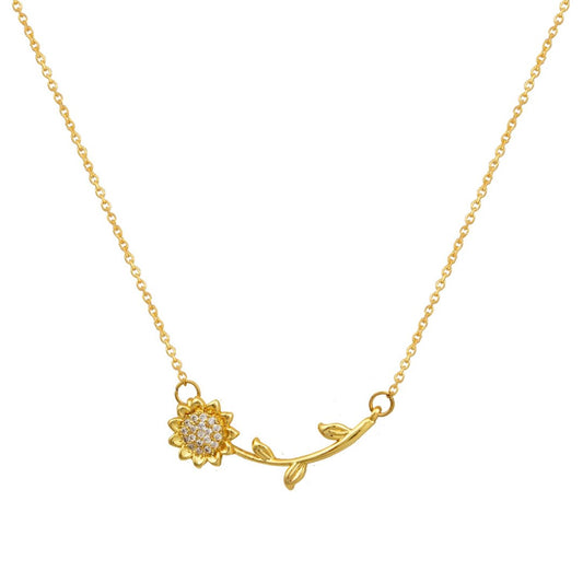 Χρυσό κολιέ με μενταγιόν ηλίανθο.