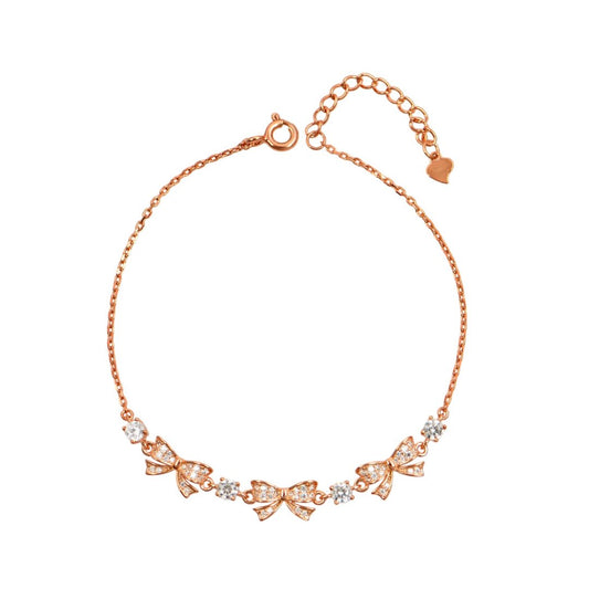 Ροζ χρυσό βραχιόλι με λεπτεπίλεπτους φιόγκους και λαμπερά ζιργκόν.