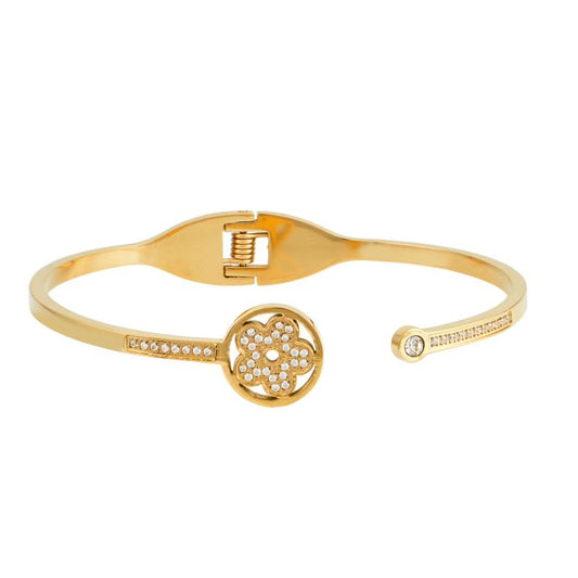 Χρυσό βραχιόλι με διακοσμητικό λουλούδι και λαμπερά ζιργκόν για θηλυκή κομψότητα.