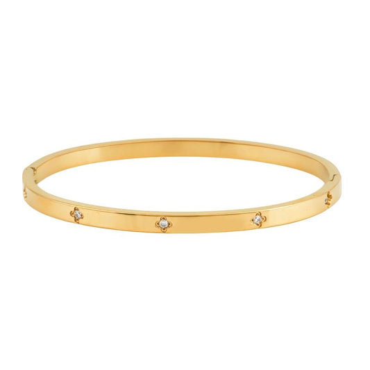 Χρυσό βραχιόλι με μινιμαλιστικό σχεδιασμό και ζιργκόν για κομψή καθημερινότητα.